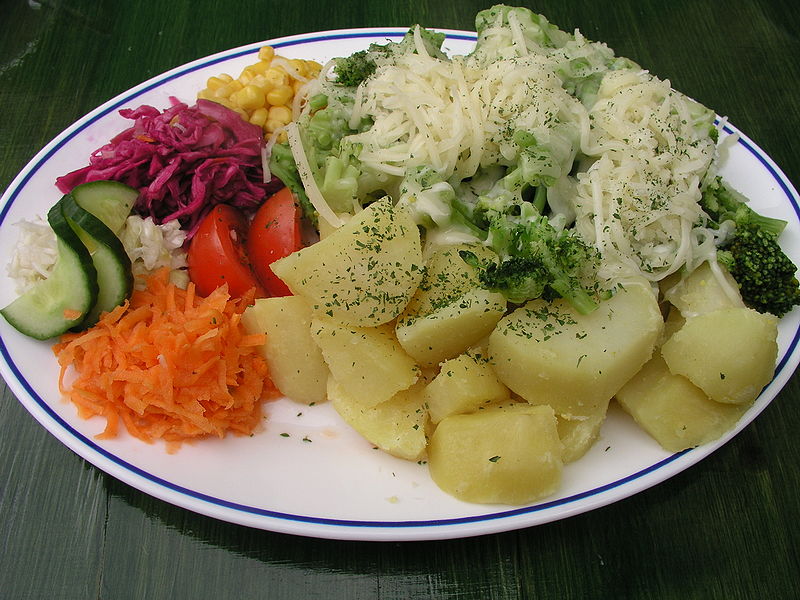 Broccoli with cheese, boiled potatoes and vegetables (corn, red cabbage, white cabbage, cucumber, tomato, carrot)