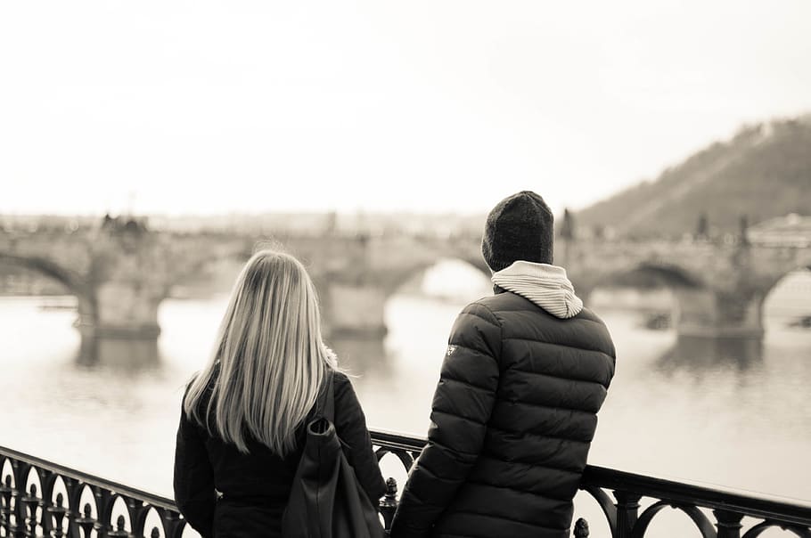 A couple watching Charles Bridge